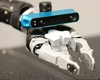 Robot's in-hand eye maps surroundings, determines hand's location