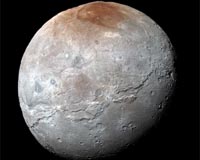 Pluto's Big Moon Charon Reveals a Colorful and Violent History