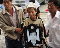 Pain and grief sink in for China riot victims