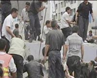Bodies line the streets as quake town's agony laid bare