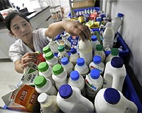 Asia on alert over tainted China milk