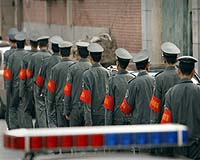 China detains second leader of rebel village