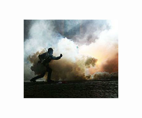 French police teargas protesters at oil giant's meeting