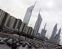 Dubai debt woes may cut CO2 but much more needed