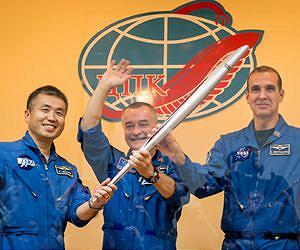 Russians take Olympic torch on historic spacewalk