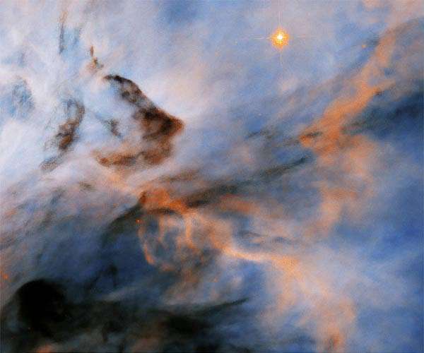 Hubble Finds Flame Nebula's Searing Stars May Halt Planet Formation
