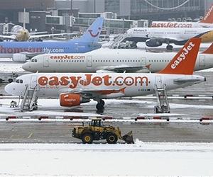Fresh British snowfalls shut airports, schools