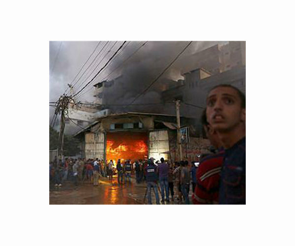 Gaza rescuers say Israeli strike on school killed 18