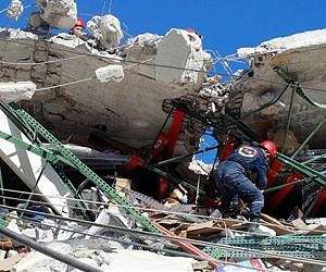 Damaged Haiti supermarket collapses with people inside