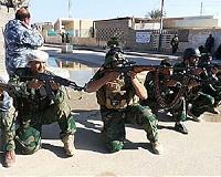 Iraq forces battle to retake town from militants
