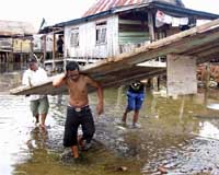 100 missing, 77 killed by burst Indonesian dam