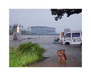 Flood-battered Japan warily eyes typhoon