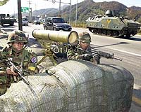 Living in the shadow of Kim Jong-Il's army