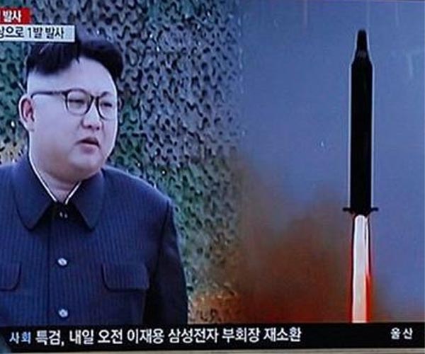 North Korea's Kim inspects new missiles before China trip