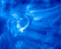Magnetic coil springs accelerate particles on the Sun