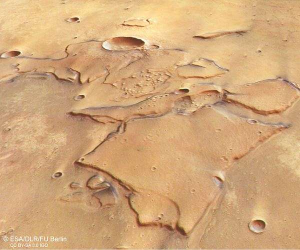 Martian butterfly crater reveals low angle impact and buried lava history