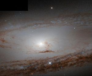 Hubble Looks At Messier 65 and Its History