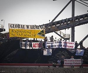 Australia climate activists freeze world's largest coal port