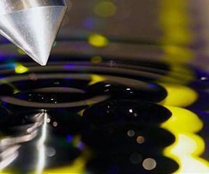 Nanoscale friction: High energy losses in the vicinity of charge density waves