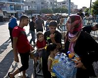 Water delivery drivers dice with death in war-torn Gaza