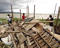 Philippines says storm damage tops four billion dollars