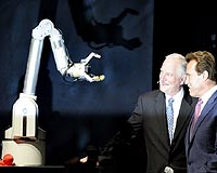 Bullish Schwarzenegger pumps up giant tech fair
