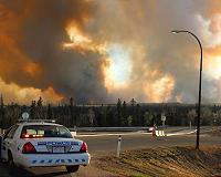 Evacuees find safe haven as wildfires engulf Canada oil region