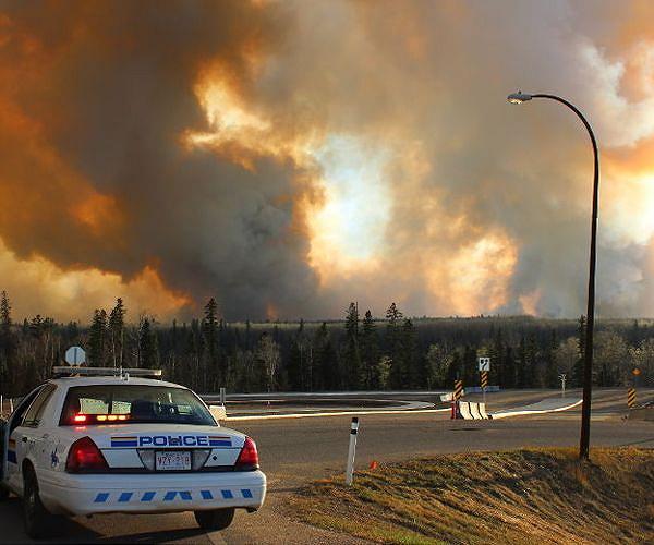 Thousands evacuated as wildfire spreads north of Los Angeles; Canada sends troops to eastern province as fire damage grows
