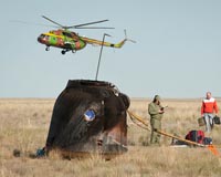 Space trio returns to Earth in Russian capsule