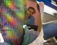 A little impurity makes nanolasers shine