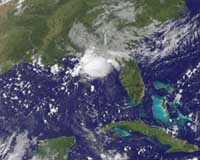 Storm hits Florida as first Atlantic hurricane gathers power