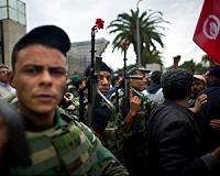 In first for Tunisia, police and soldiers head to polls