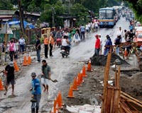 Philippine economy falls victim to twin storms