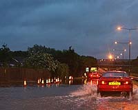 Flood-Hit Britain Braces For More; As Heatwave Burns Greece