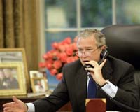 Bush plays joker, honors father with 'awesome' ship