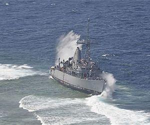 Salvage crews break up US Navy ship in Philippines